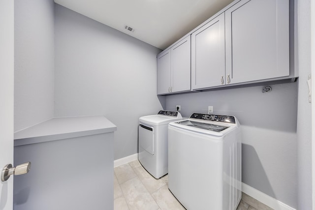 5402 Oriole St, Houston, TX 77017 - laundry room featuring cabinet space and washer and clothes dryer