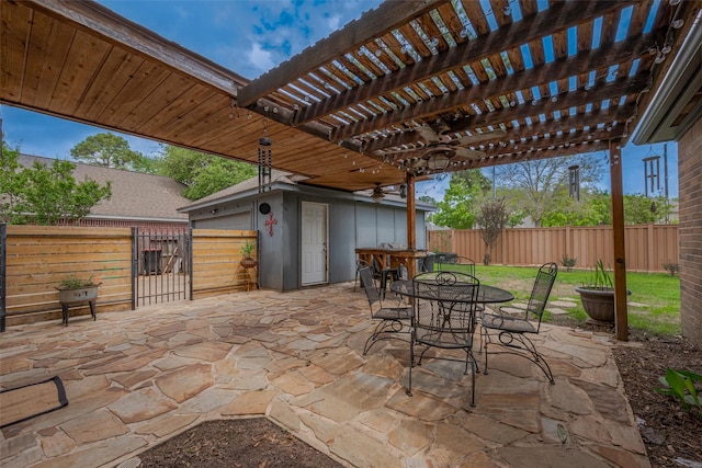 15610 Township Glen Ln, Cypress, TX 77433 - fenced backyard with an outbuilding, a pergola, outdoor dining space, and a patio