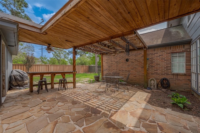 15610 Township Glen Ln, Cypress, TX 77433 - fenced backyard featuring outdoor dining space, a patio, and area for grilling