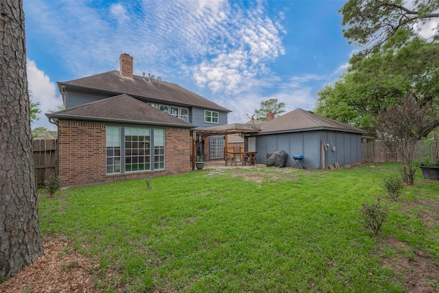 15610 Township Glen Ln, Cypress, TX 77433 - rear view of house with brick siding, a fenced backyard, a chimney, a patio area, and a pergola