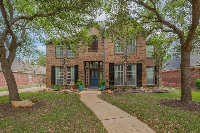 15610 Township Glen Ln, Cypress, TX 77433 - traditional-style house featuring brick siding and a front lawn
