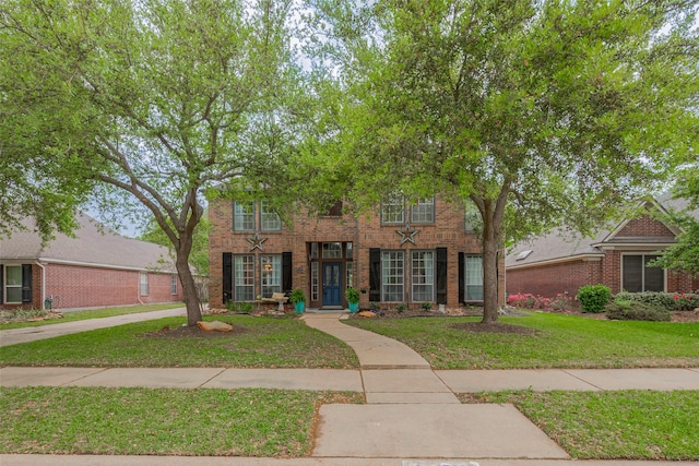 15610 Township Glen Ln, Cypress, TX 77433 - view of front of home with a front yard and brick siding