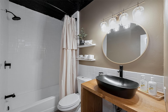 15610 Township Glen Ln, Cypress, TX 77433 - full bathroom with shower / tub combo with curtain, tile walls, and a wainscoted wall