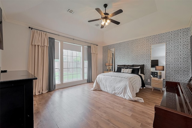 15610 Township Glen Ln, Cypress, TX 77433 - bedroom with light wood finished floors, access to outside, ornamental molding, ceiling fan, and wallpapered walls