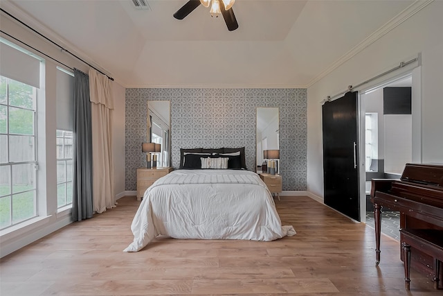 15610 Township Glen Ln, Cypress, TX 77433 - bedroom with wallpapered walls, ornamental molding, light wood-type flooring, a tray ceiling, and ceiling fan