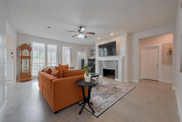 15610 Township Glen Ln, Cypress, TX 77433 - living room with concrete flooring, a high end fireplace, ceiling fan, and recessed lighting