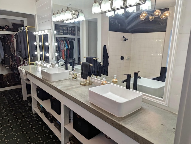 15610 Township Glen Ln, Cypress, TX 77433 - bathroom featuring a spacious closet, double vanity, tile patterned floors, and a shower