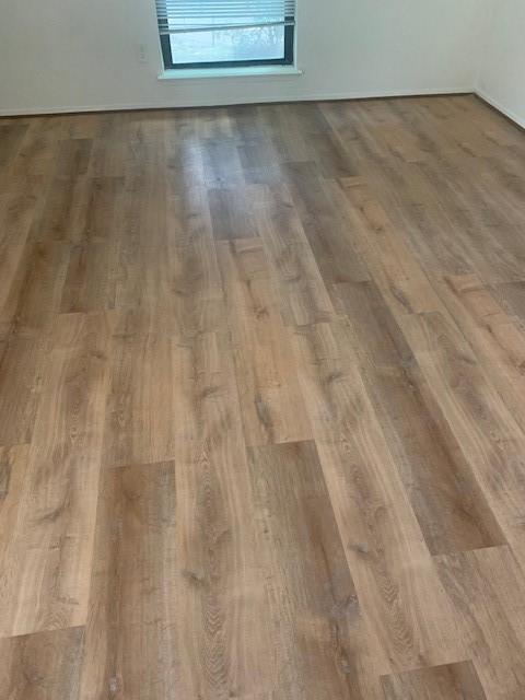 2425 Augusta Dr Unit 7, Houston, TX 77057 - empty room featuring wood finished floors