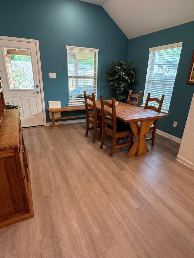24223 Palomino Sage Trl, Katy, TX 77493 - dining space featuring vaulted ceiling, light wood-style floors, and healthy amount of natural light