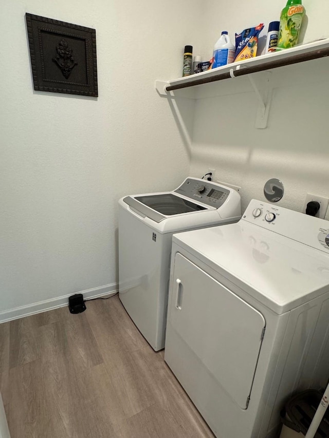 24223 Palomino Sage Trl, Katy, TX 77493 - laundry room with separate washer and dryer and light wood-style floors