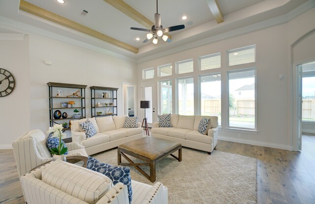 12607 Smokey Sunset Ct, Cypress, TX 77433 - living area featuring light wood-style floors, a ceiling fan, a towering ceiling, recessed lighting, and beamed ceiling