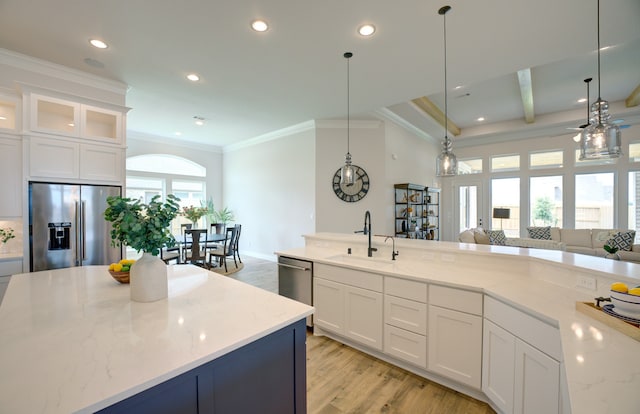 12607 Smokey Sunset Ct, Cypress, TX 77433 - kitchen with stainless steel appliances, light wood-style flooring, crown molding, recessed lighting, and light stone countertops