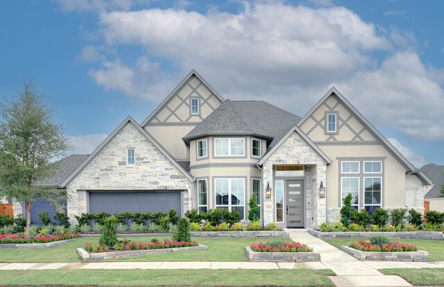 12607 Smokey Sunset Ct, Cypress, TX 77433 - tudor home featuring stucco siding, stone siding, a front lawn, and a garage