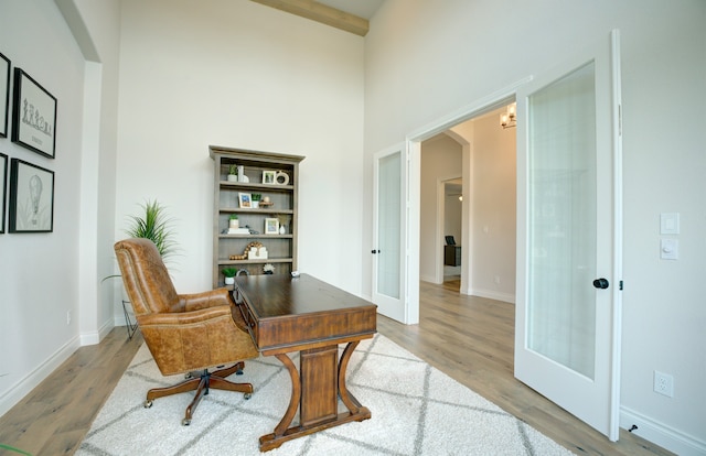 12607 Smokey Sunset Ct, Cypress, TX 77433 - office space featuring arched walkways, french doors, wood finished floors, and a high ceiling