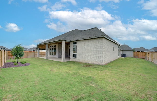 12607 Smokey Sunset Ct, Cypress, TX 77433 - rear view of property with brick siding, a patio, a fenced backyard, and roof with shingles