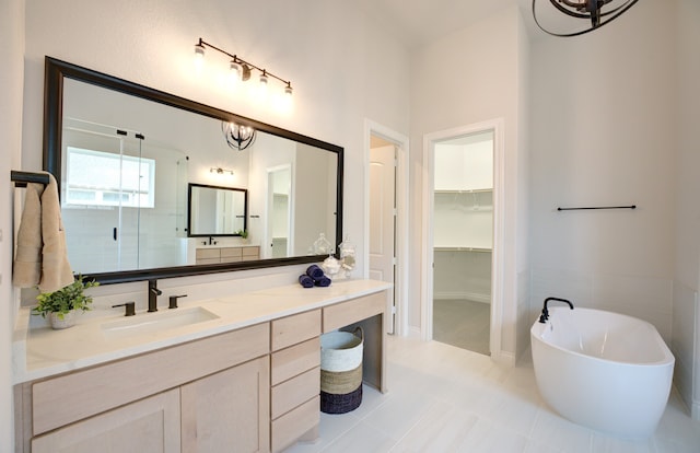 12607 Smokey Sunset Ct, Cypress, TX 77433 - full bath with vanity, a freestanding bath, a spacious closet, a chandelier, and a shower stall