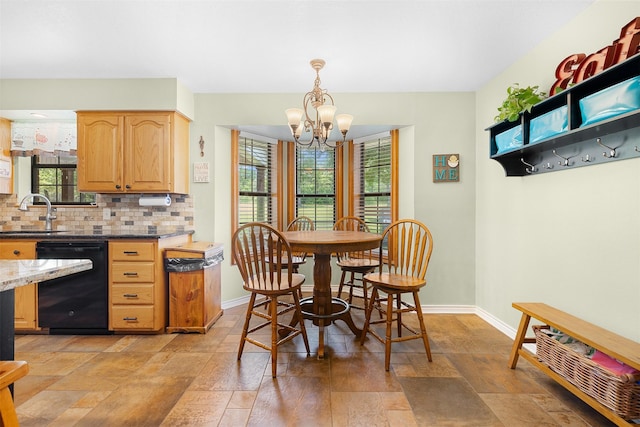 3135 Forest Hill E Rd, La Grange, TX 78945 - dining room with a chandelier and light stone finish floors
