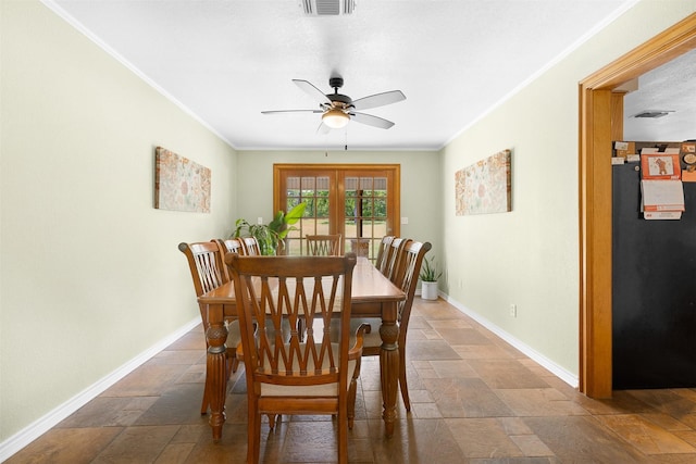 3135 Forest Hill E Rd, La Grange, TX 78945 - dining area with stone tile floors, crown molding, and ceiling fan