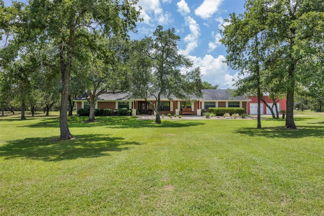 3135 Forest Hill E Rd, La Grange, TX 78945 - view of green lawn with a porch