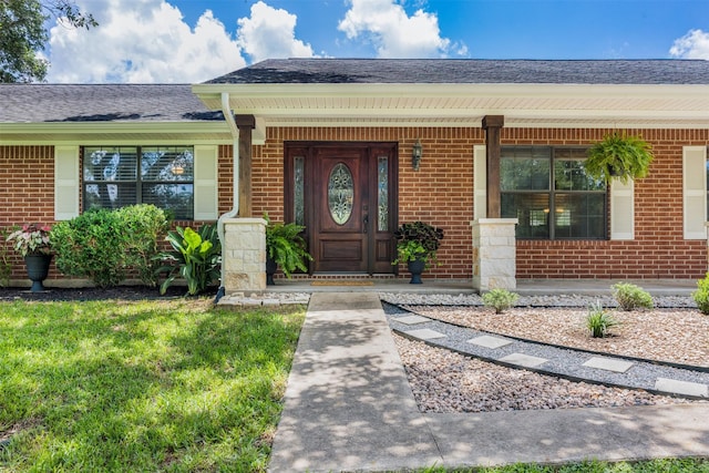 3135 Forest Hill E Rd, La Grange, TX 78945 - entrance to property featuring brick siding, a porch, and a shingled roof