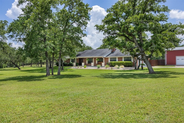 3135 Forest Hill E Rd, La Grange, TX 78945 - view of front of house with a garage and a front yard