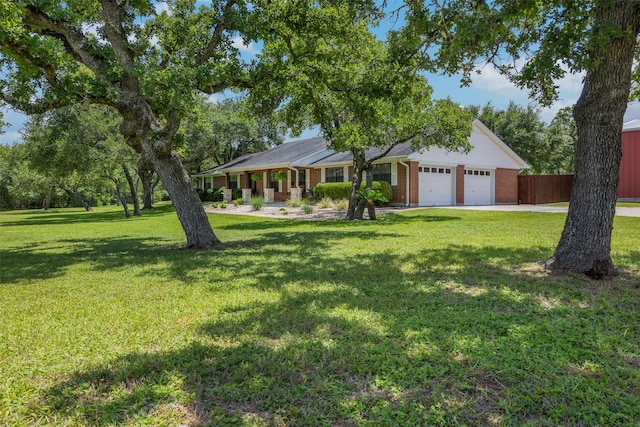 3135 Forest Hill E Rd, La Grange, TX 78945 - ranch-style house featuring a garage, brick siding, and driveway