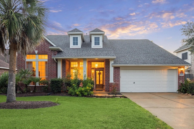 3732 Coral Reef Dr, Seabrook, TX 77586 - view of front facade featuring brick siding, roof with shingles, concrete driveway, and a garage