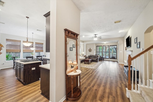 3732 Coral Reef Dr, Seabrook, TX 77586 - hall with wood finished floors, stairs, and a textured ceiling