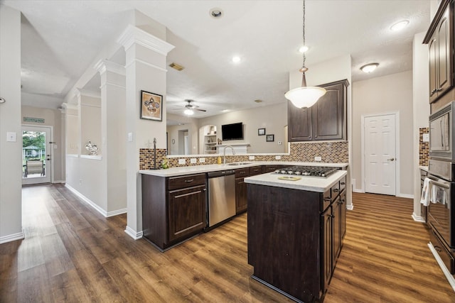 3732 Coral Reef Dr, Seabrook, TX 77586 - kitchen featuring stainless steel appliances, dark brown cabinetry, light countertops, ceiling fan, and decorative backsplash