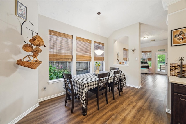 3732 Coral Reef Dr, Seabrook, TX 77586 - dining room featuring plenty of natural light, dark wood-type flooring, and vaulted ceiling