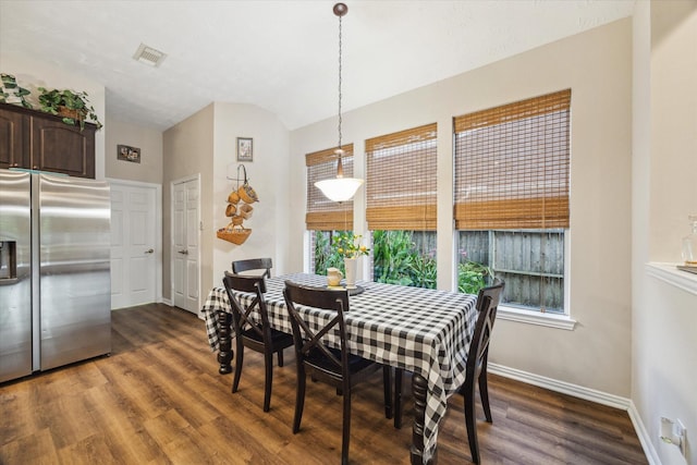 3732 Coral Reef Dr, Seabrook, TX 77586 - dining room featuring dark wood finished floors and vaulted ceiling
