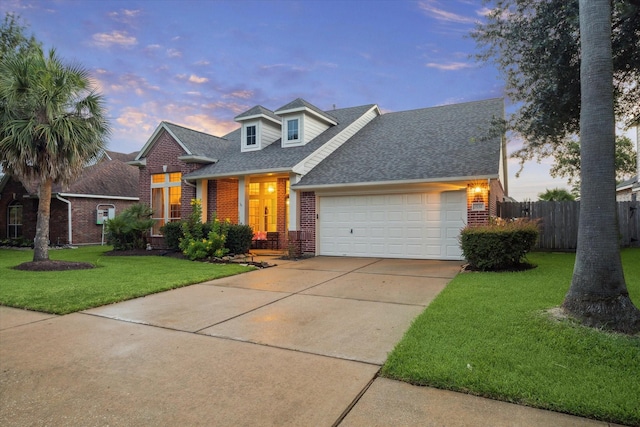 3732 Coral Reef Dr, Seabrook, TX 77586 - traditional-style home featuring brick siding, a shingled roof, a garage, and driveway