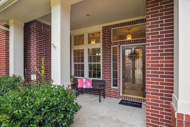 3732 Coral Reef Dr, Seabrook, TX 77586 - view of exterior entry featuring brick siding and a porch