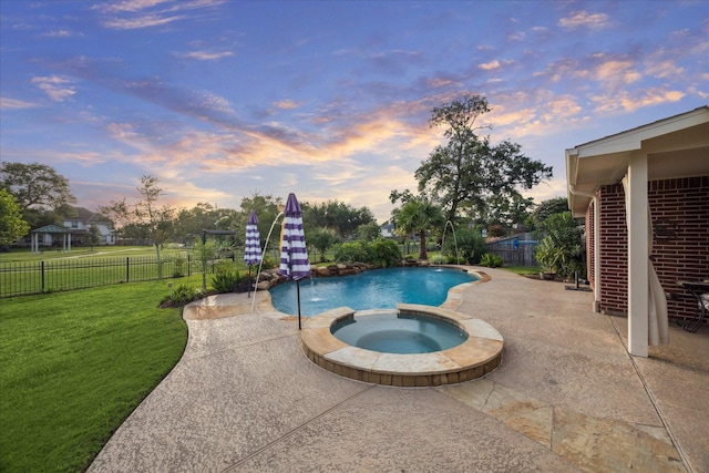 3732 Coral Reef Dr, Seabrook, TX 77586 - pool at dusk with a patio, a fenced backyard, and a pool with connected hot tub