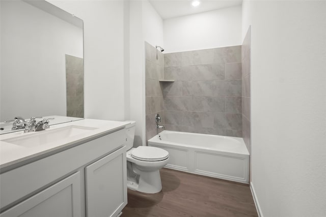 2435 Rooke Rd, Bryan, TX 77807 - full bathroom featuring wood finished floors, vanity, and bathtub / shower combination
