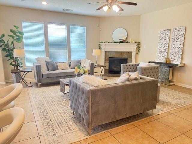 4126 Winesap Bend Dr, Stafford, TX 77477 - living area featuring light tile patterned floors, ceiling fan, healthy amount of natural light, a fireplace, and recessed lighting