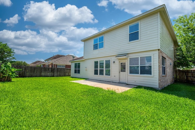 4126 Winesap Bend Dr, Stafford, TX 77477 - rear view of house featuring a fenced backyard, a patio area, and brick siding