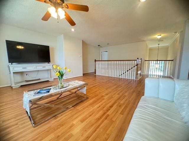 4126 Winesap Bend Dr, Stafford, TX 77477 - living area with ceiling fan, wood finished floors, and recessed lighting
