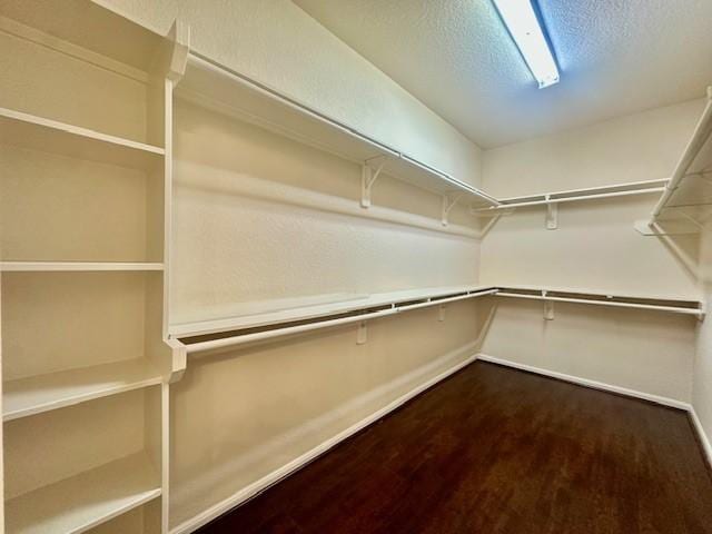 4126 Winesap Bend Dr, Stafford, TX 77477 - walk in closet featuring dark wood-type flooring