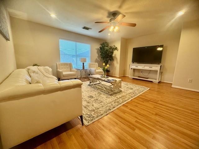 4126 Winesap Bend Dr, Stafford, TX 77477 - living area featuring a ceiling fan and wood finished floors
