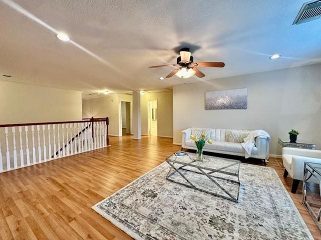 4126 Winesap Bend Dr, Stafford, TX 77477 - living room with a ceiling fan, wood finished floors, and recessed lighting
