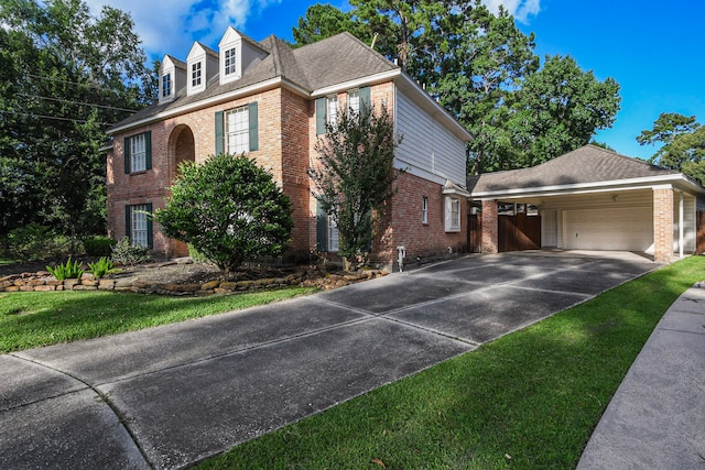 5838 Mountain View Dr, Houston, TX 77345 - view of front of property featuring brick siding, driveway, a garage, and a carport