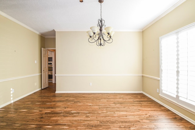 5838 Mountain View Dr, Houston, TX 77345 - unfurnished room featuring plenty of natural light, a chandelier, ornamental molding, and wood finished floors
