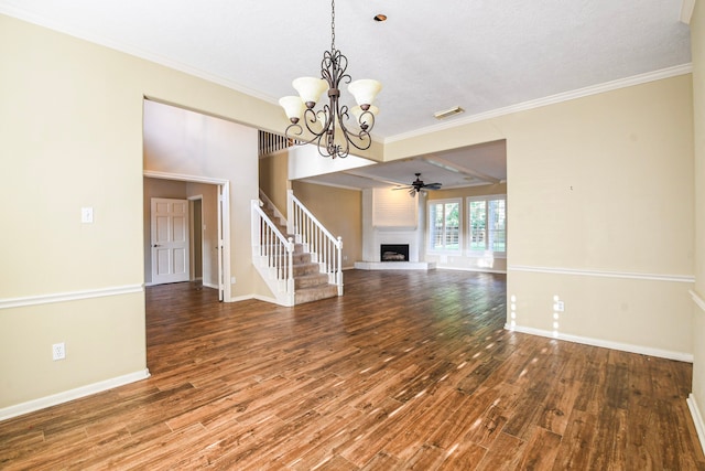5838 Mountain View Dr, Houston, TX 77345 - unfurnished living room featuring wood finished floors, a fireplace, stairs, ceiling fan, and ornamental molding