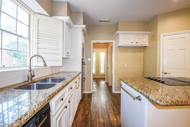 5838 Mountain View Dr, Houston, TX 77345 - kitchen with dark wood-style flooring, light stone counters, white cabinetry, and black electric cooktop
