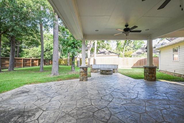 5838 Mountain View Dr, Houston, TX 77345 - fenced backyard with ceiling fan, a patio, and an outdoor fire pit