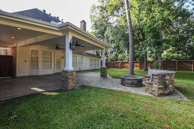 5838 Mountain View Dr, Houston, TX 77345 - fenced yard featuring an outdoor fire pit, a patio area, and a ceiling fan