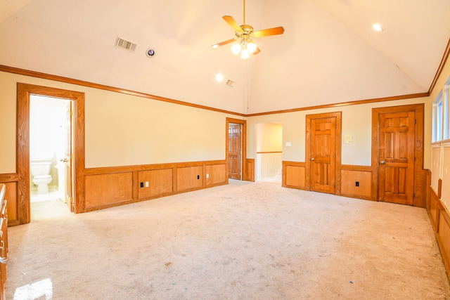 5838 Mountain View Dr, Houston, TX 77345 - unfurnished room featuring wainscoting, light carpet, a ceiling fan, a decorative wall, and high vaulted ceiling