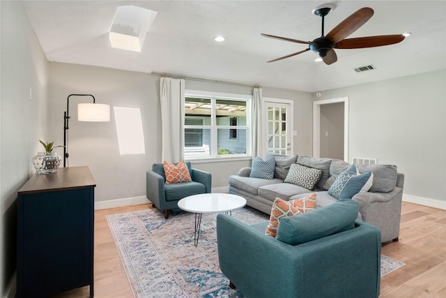 33933 Deer Creek Way, Stagecoach, TX 77355 - living area featuring ceiling fan, light wood-style floors, a skylight, and recessed lighting