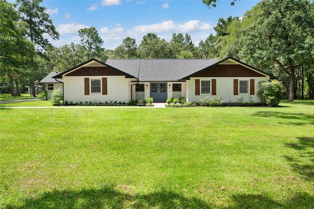 33933 Deer Creek Way, Stagecoach, TX 77355 - ranch-style house with a front lawn and view of wooded area